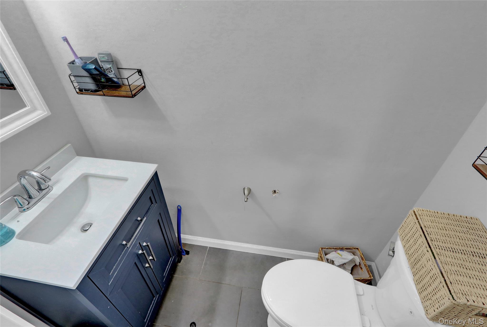 220 East Chester Street Long Beach, NY 11561 - Photo 19 of 26 a bathroom with a sink vanity and mirror