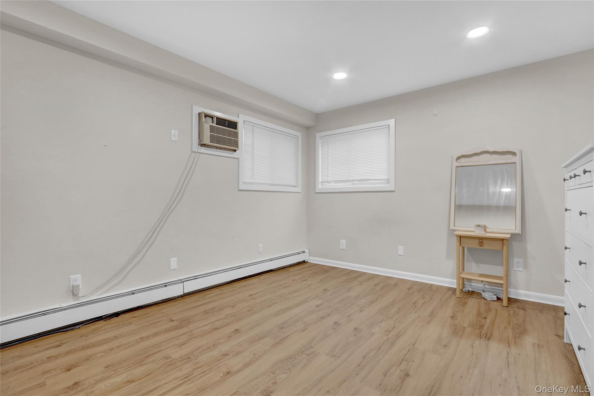 220 East Chester Street Long Beach, NY 11561 - Photo 9 of 26 a view of empty room with wooden floor and sink