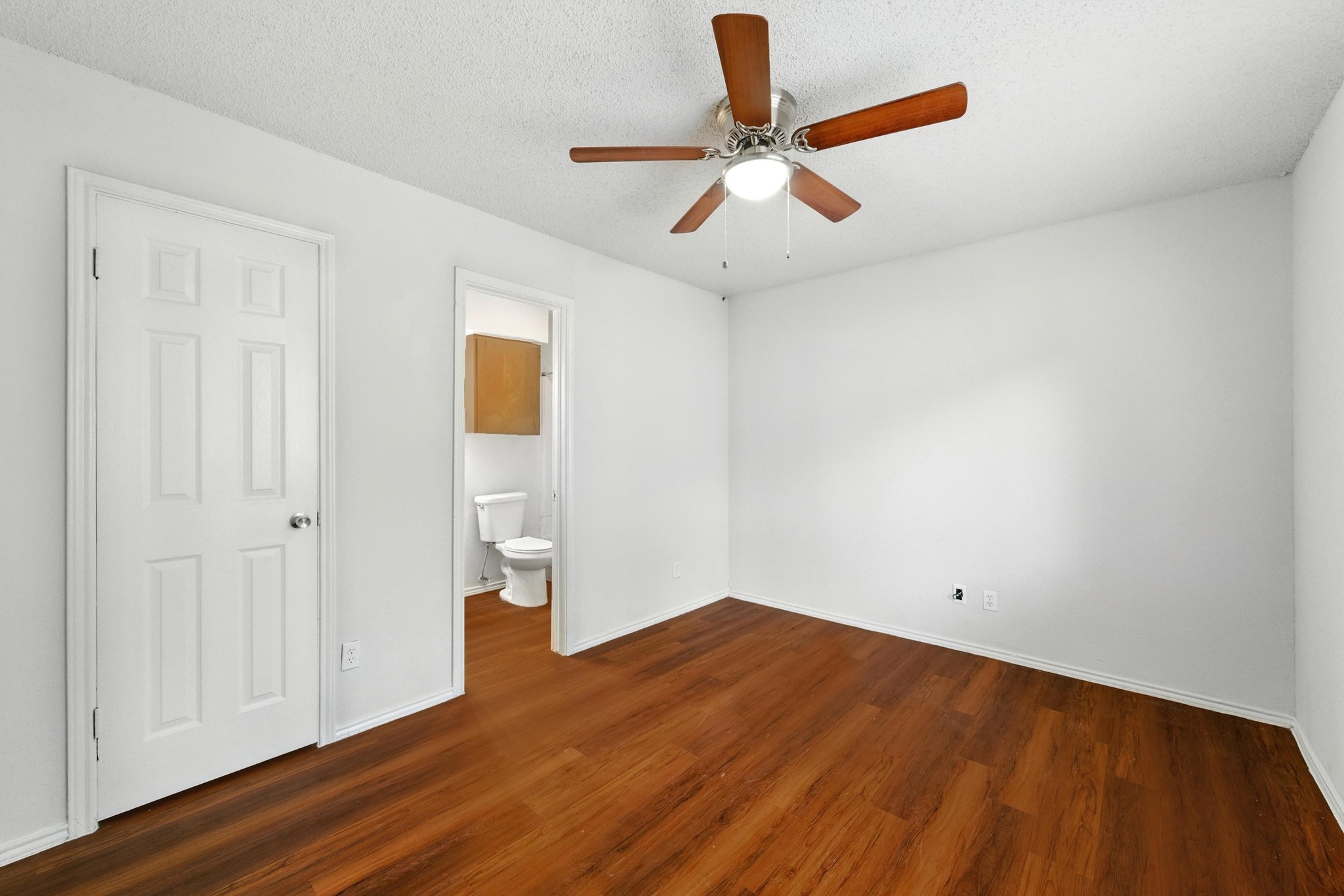 5707 Spring Meadow Road Austin, TX 78744 - Photo 15 of 21 a view of empty room with wooden floor