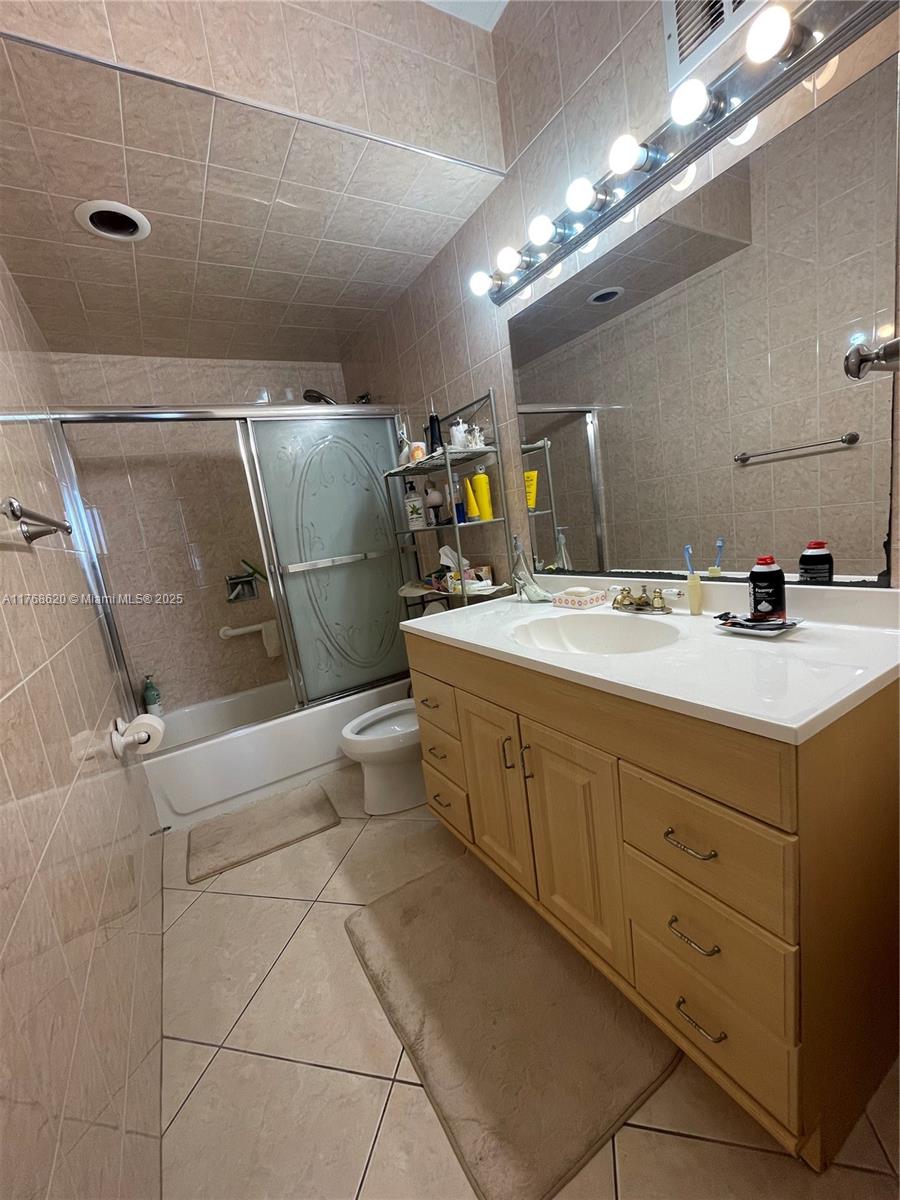 Oceanside Hallandale Beach, FL 33009 - Photo 16 of 49 a room with a washing machine and sink