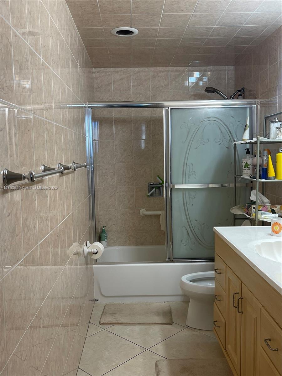 Oceanside Hallandale Beach, FL 33009 - Photo 17 of 49 a bathroom with a sink a toilet and shower