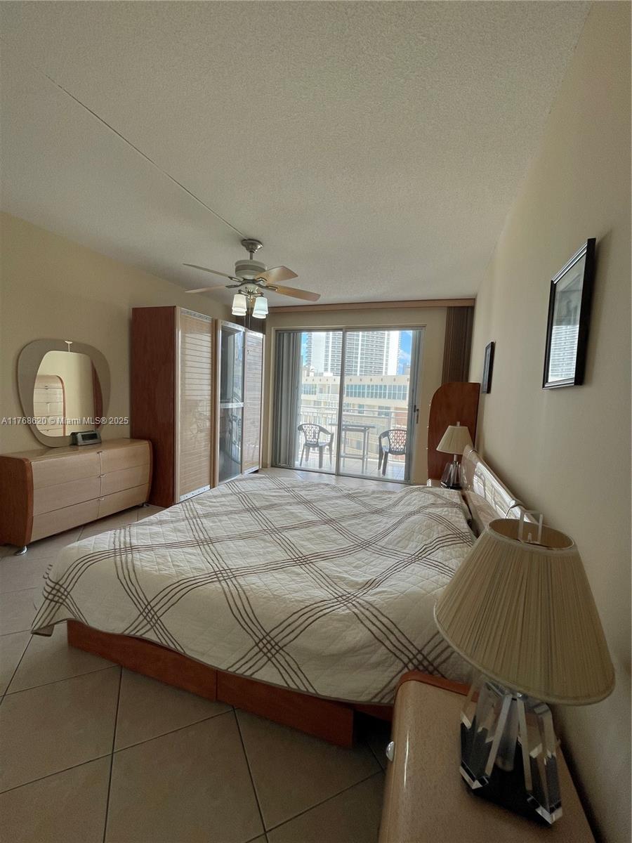 Oceanside Hallandale Beach, FL 33009 - Photo 20 of 49 a bedroom with a bed and a window