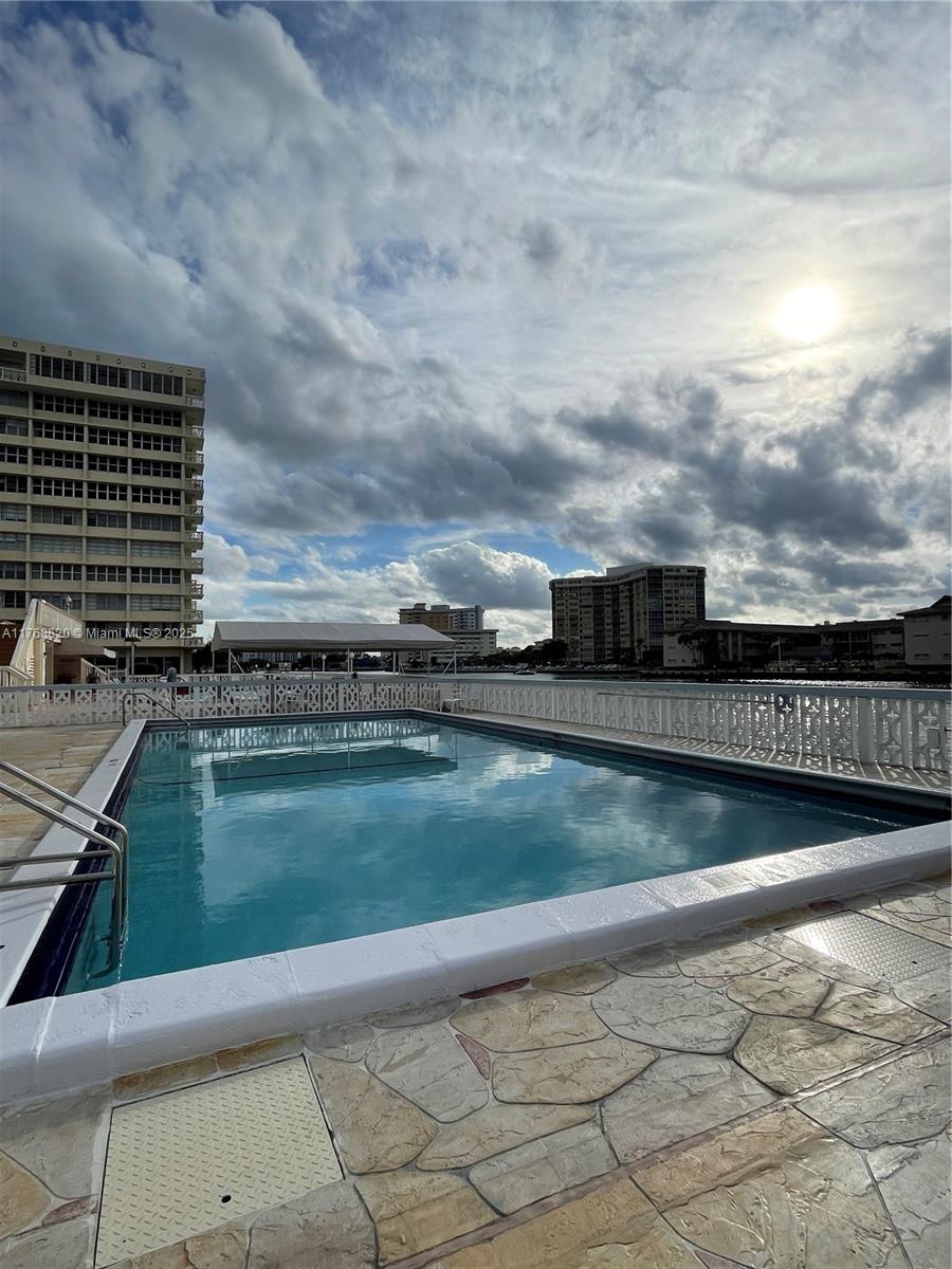 Oceanside Hallandale Beach, FL 33009 - Photo 30 of 49 a view of a swimming pool with an outdoor seating