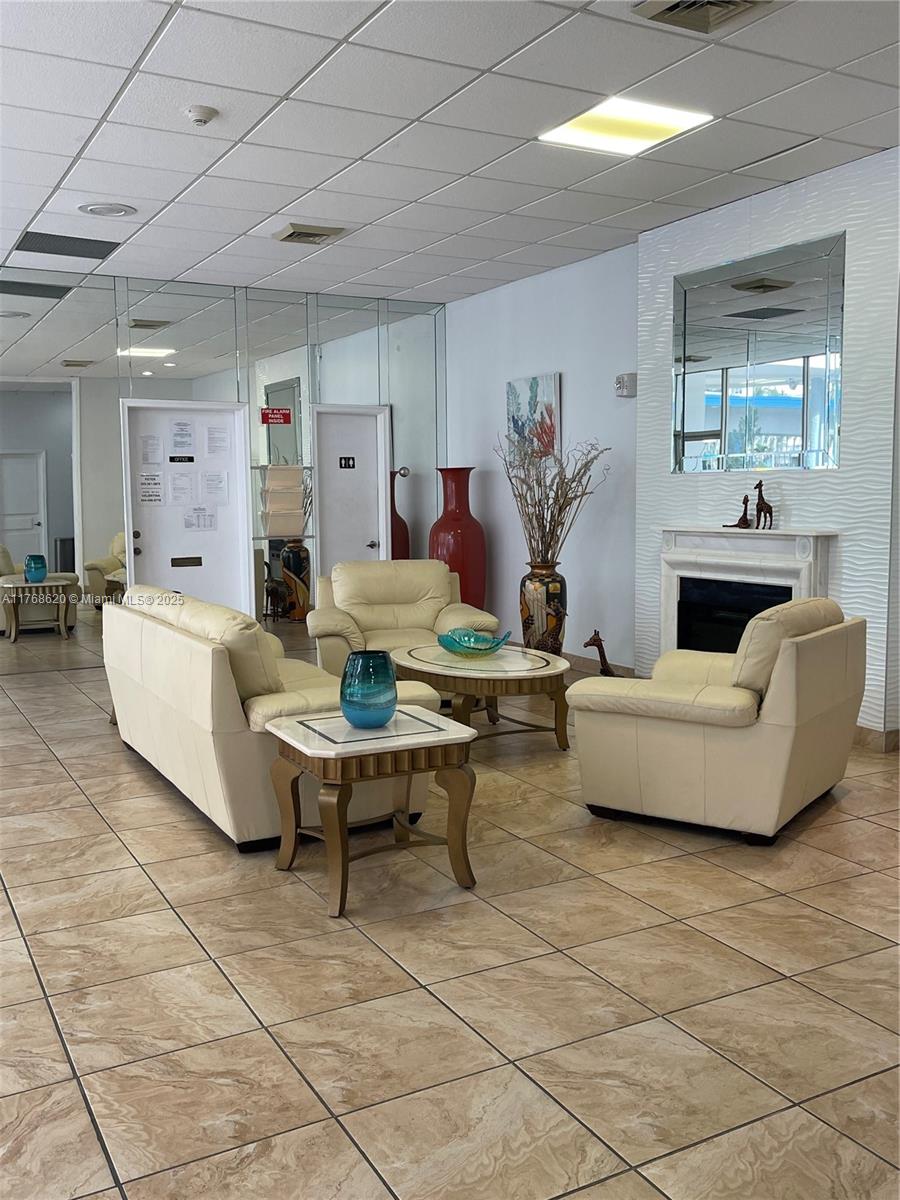 Oceanside Hallandale Beach, FL 33009 - Photo 47 of 49 a living room with furniture and a table