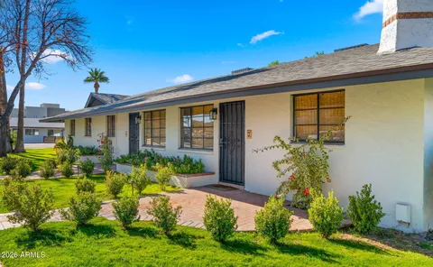 a kitchen with granite countertop a stove and a sink