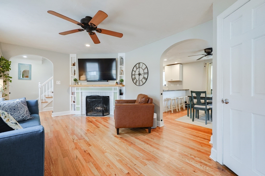 14 Cardinal Road Worcester, MA 01602 - Photo 11 of 28 a living room with furniture a fireplace and a flat screen tv
