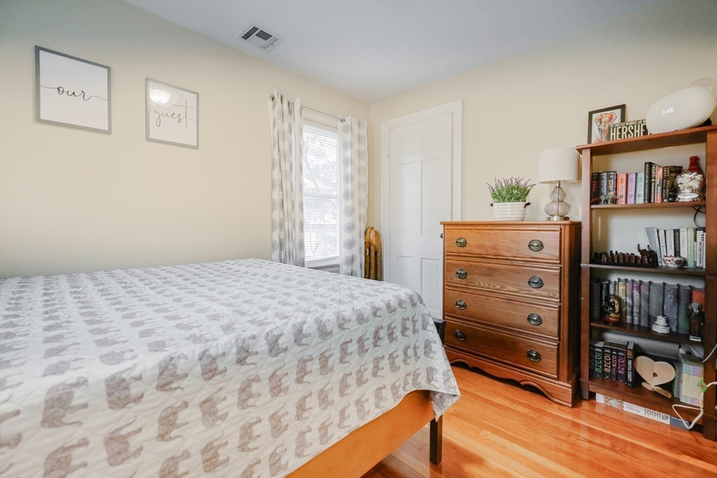 14 Cardinal Road Worcester, MA 01602 - Photo 23 of 28 a bedroom with a bed and a book shelf