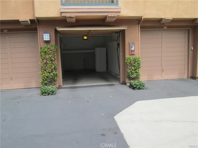 a sign broad in front of flowers