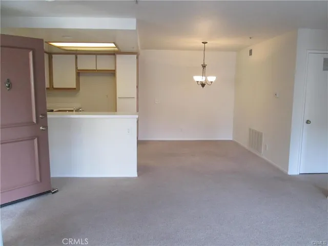 a view of a room with large windows