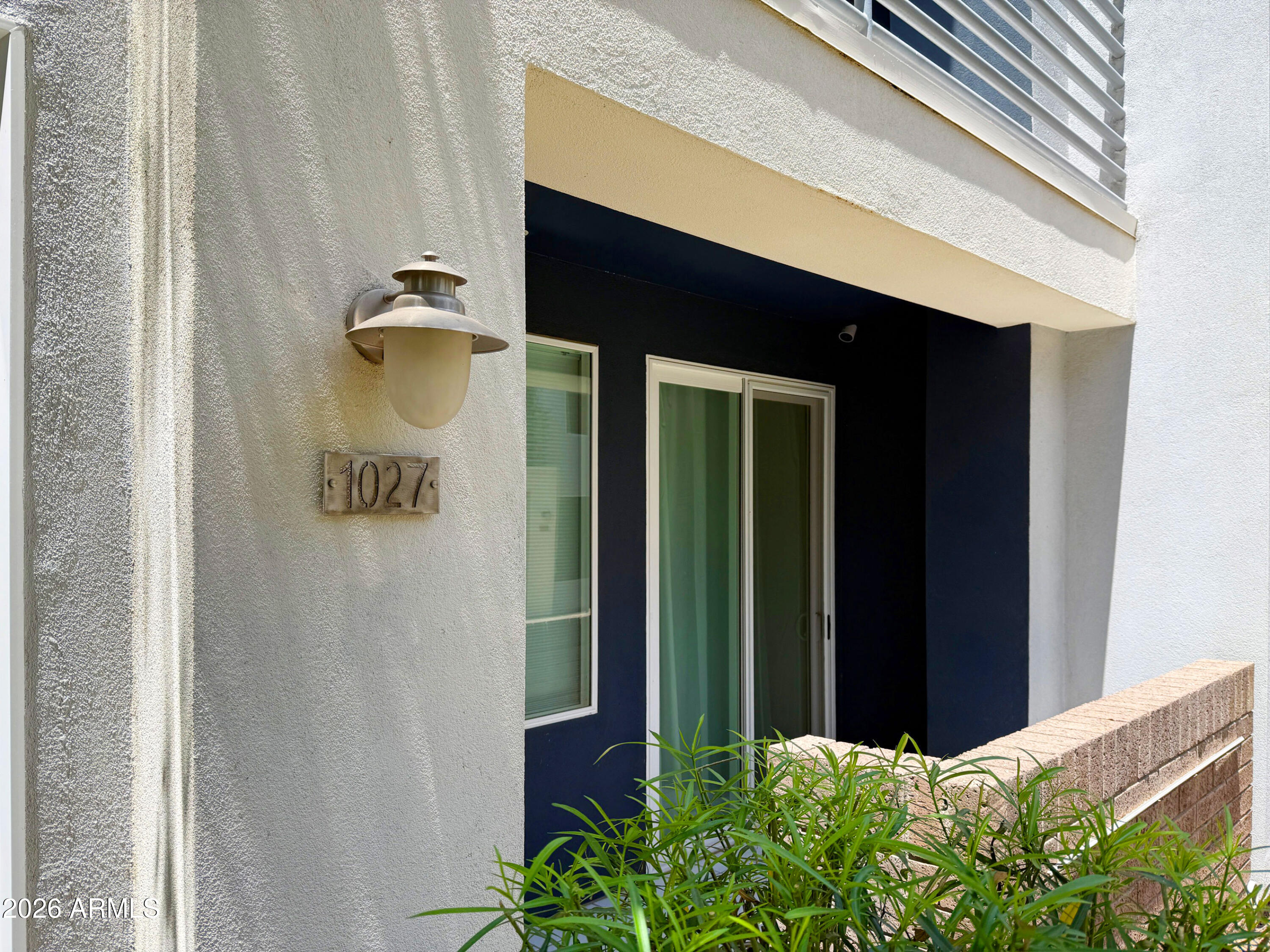 3633 North 3rd Avenue, Unit 1027 Phoenix, AZ 85013 - Photo 17 of 29 a front view of a house with a plants