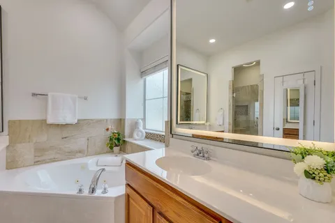 a bathroom with a bathtub and a sink