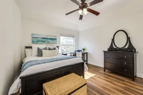 a bedroom with a bed and a dresser