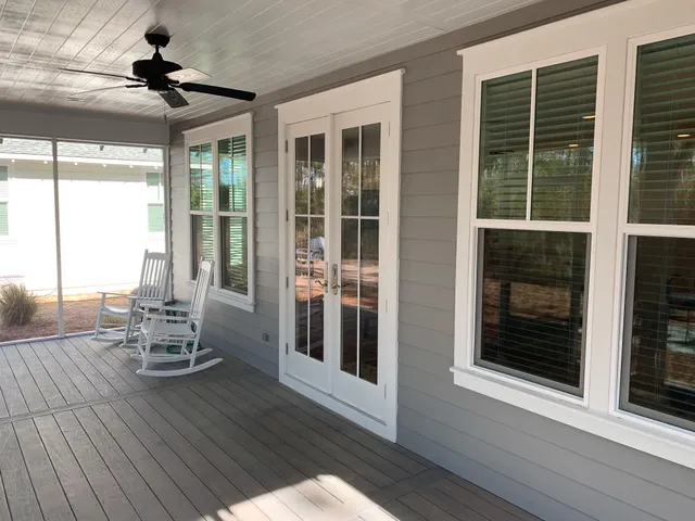 a view of a room that has a couch and a table in balcony