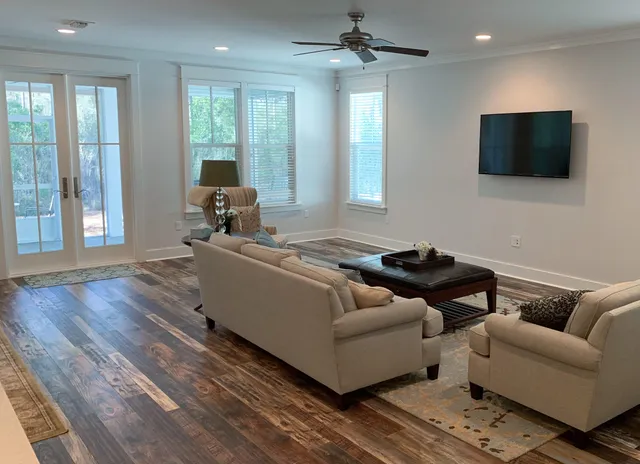 a living room with furniture and a flat screen tv