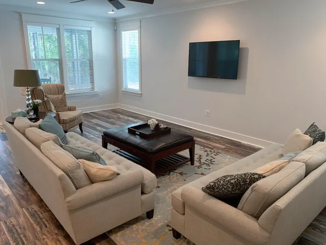 a living room with furniture and a flat screen tv