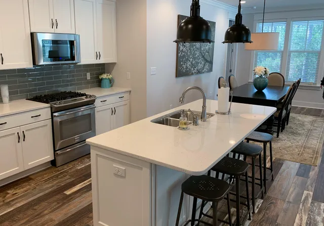 a kitchen with a table chairs and a stove