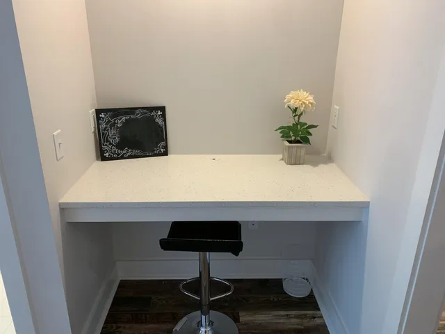 a room with a table and potted plant