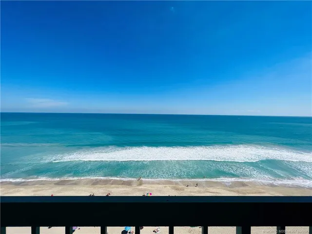 a bed room with a bed and a flat tv screen