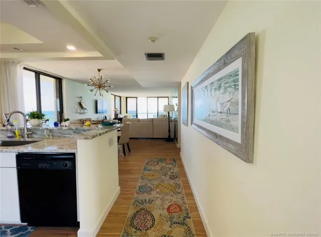 a kitchen with a sink appliances and cabinets