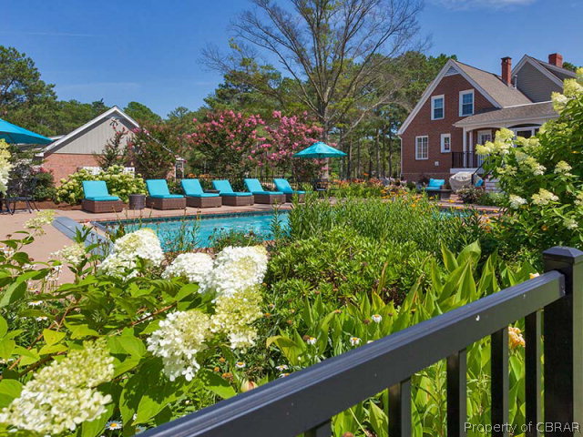 155 Lillys Neck Road Moon, VA 23119 - Photo 33 of 38 What a waterfront pool with a very pretty, very manageable garden around it with lovely perennials
