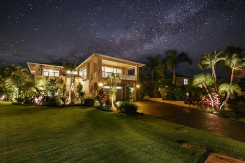 a view of a patio with table and chairs and potted plants