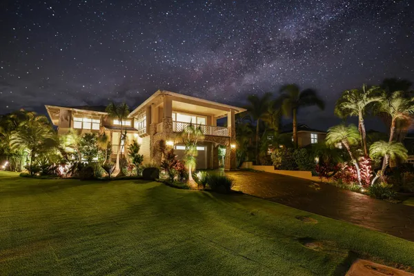 a view of a patio with table and chairs and potted plants