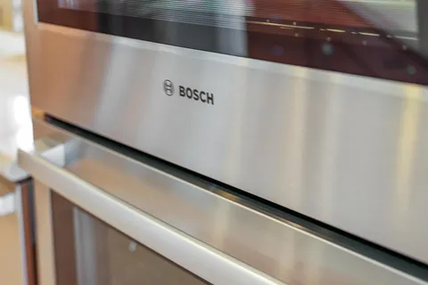 a kitchen with stainless steel appliances a refrigerator sink and cabinets