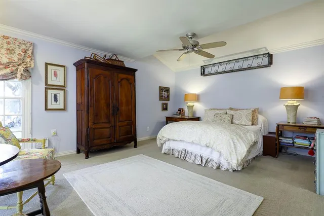 a bedroom with a bed and furniture