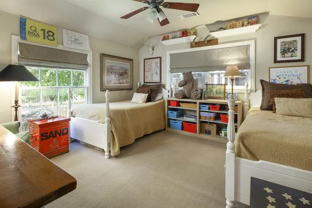 a bedroom with furniture and a bed