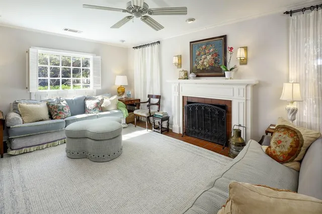 a living room with furniture and a fireplace