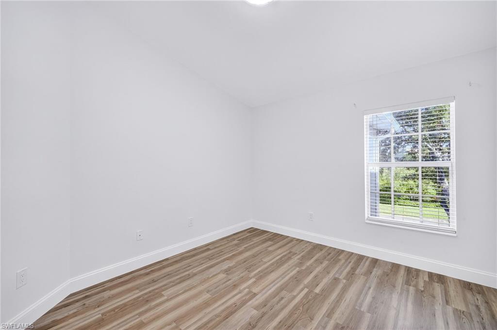 16161 Caldera Lane, Unit 42 Naples, FL 34110 - Photo 9 of 16 an empty room with a window
