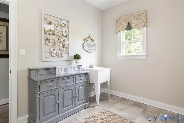 a dining room with wooden floor closet and a window