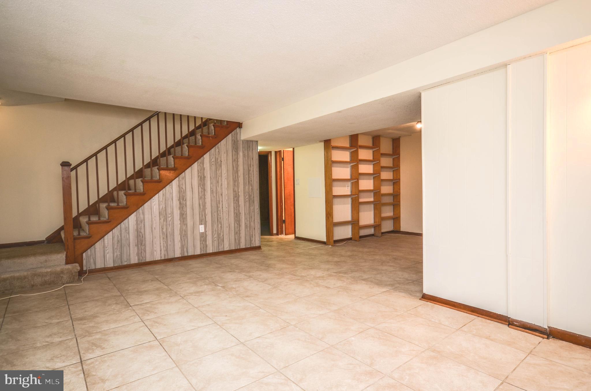 2034 Glen Ross Road Silver Spring, MD 20910 - Photo 23 of 40 a view of an empty room with stairs