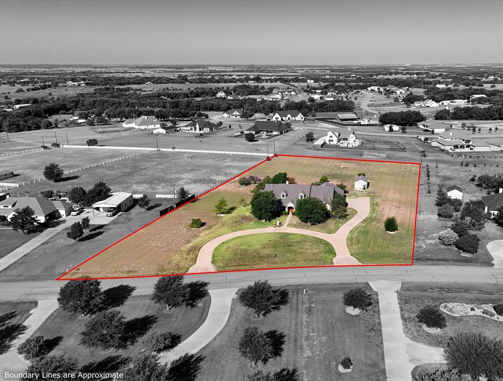 504 Casa Del Rancho Road Lorena, TX 76655 - Photo 40 of 40 Expansive property featuring a circular driveway, mature trees, a detached outbuilding, and significant undeveloped land