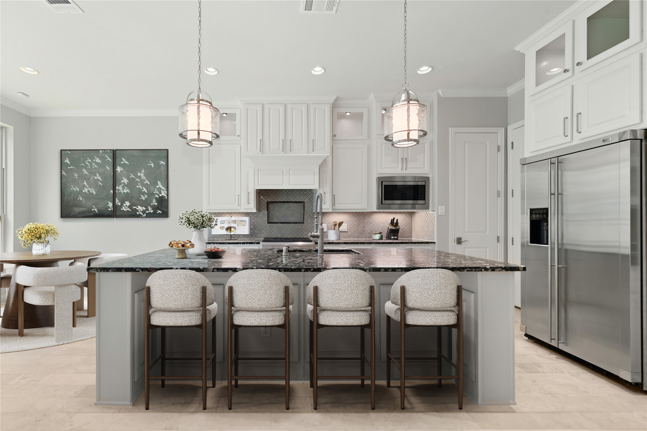 98 Herons Flight Place Spring, TX 77389 - Photo 8 of 29 Gourmet kitchen offers granite countertops, stainless appliances, custom white cabinetry, and abundant natural light. *Virtually Staged