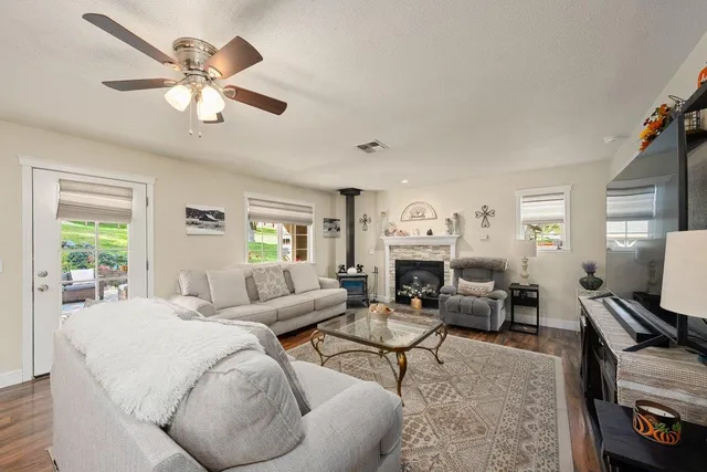 a spacious bedroom with a bed and a dresser