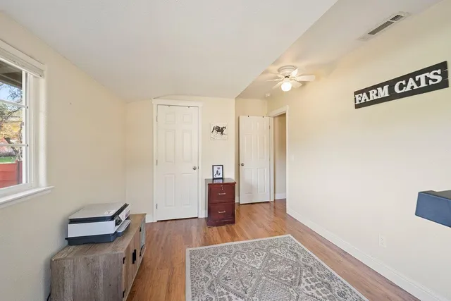 a kitchen with stainless steel appliances kitchen island granite countertop a refrigerator and a stove top oven