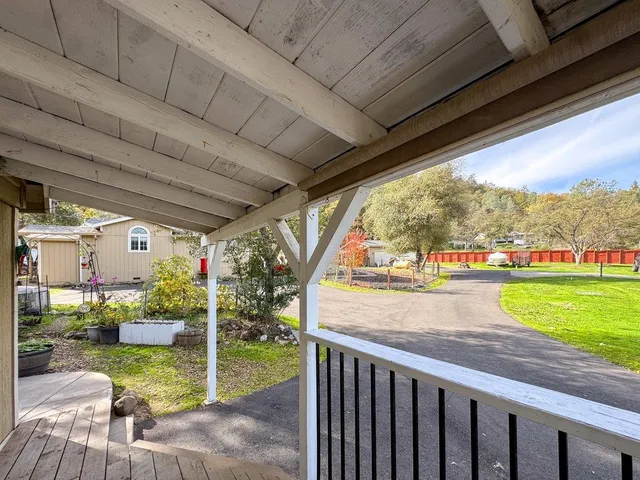 a view of a house with a yard porch and sitting area