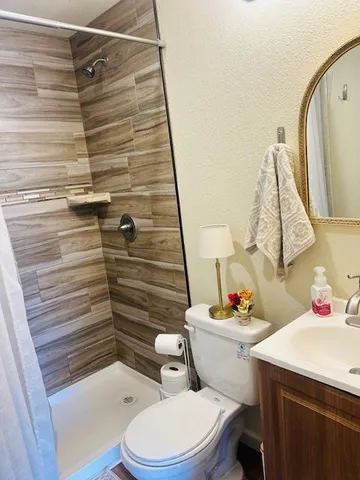 a view of a park with large trees