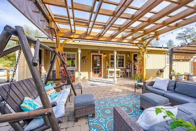 a view of a house with swimming pool and a garden