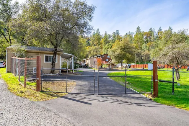a view of swimming pool with outdoor seating and plants