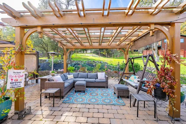 an aerial view of a house with a yard basket ball court and outdoor seating