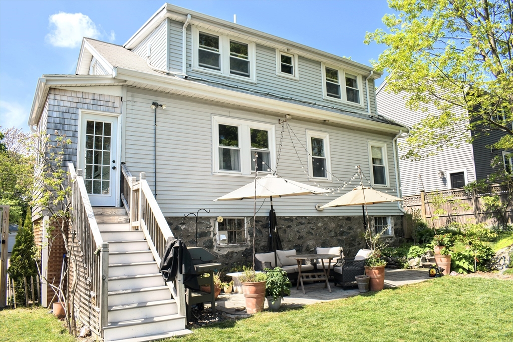 12 Searle Road, Unit 12 Boston, MA 02132 - Photo 4 of 35 a backyard of a house with yard and outdoor seating