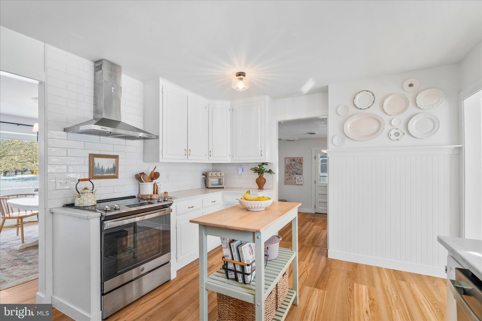 7997 Pleasant Court Frederick, MD 21701 - Photo 18 of 78 a kitchen with stainless steel appliances a stove a refrigerator and a fireplace