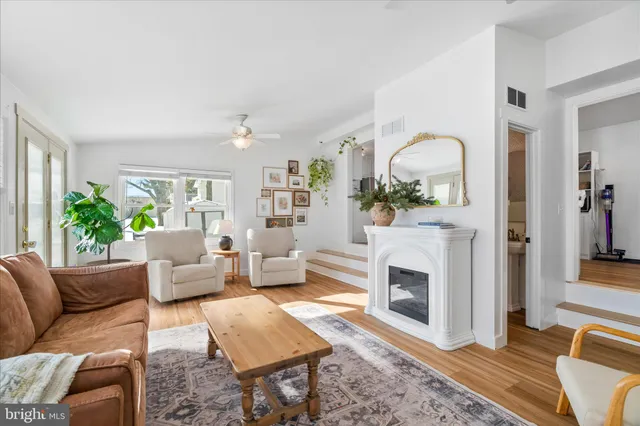 a view of a hallway view with wooden floor and staircase