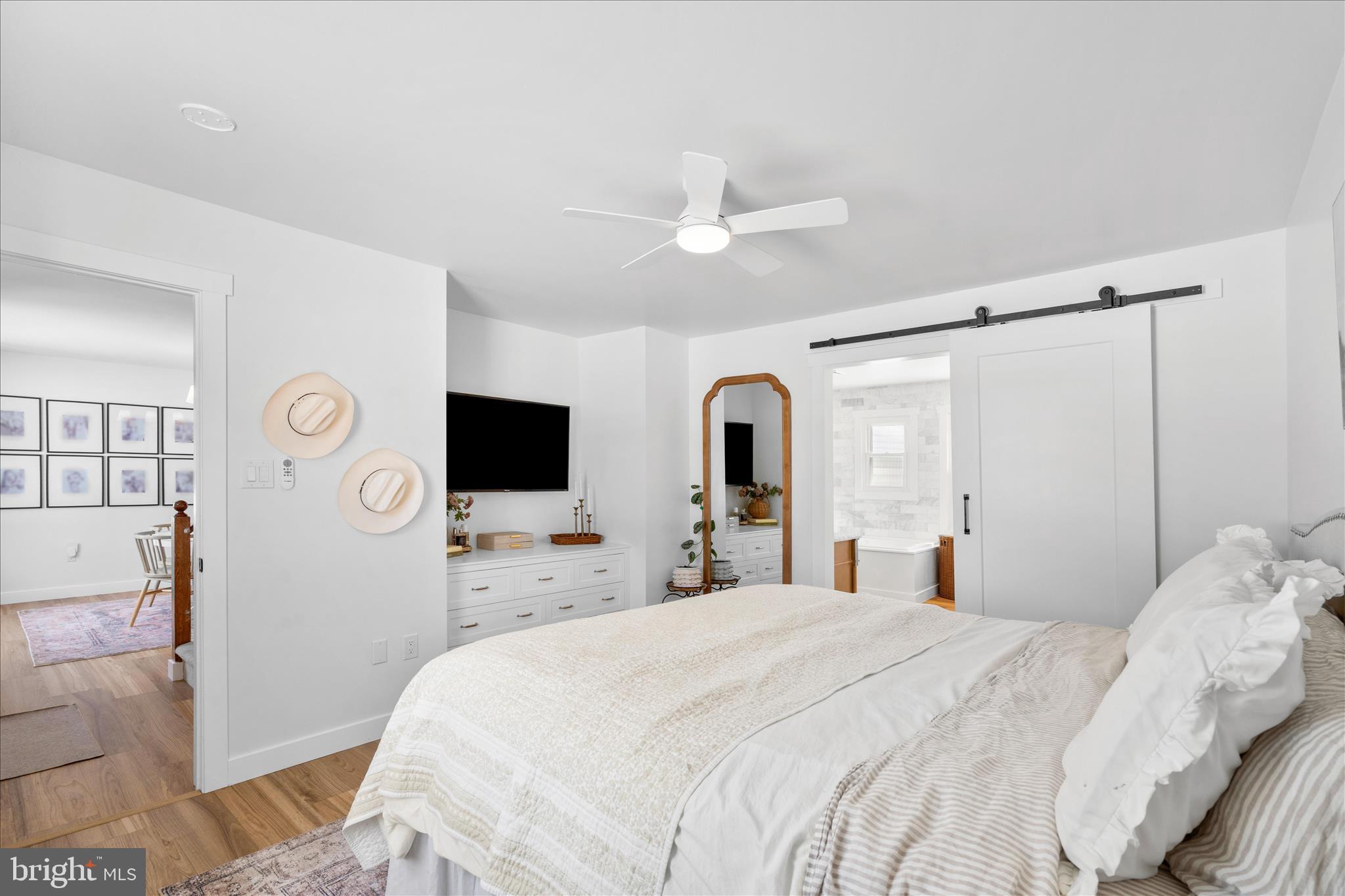 7997 Pleasant Court Frederick, MD 21701 - Photo 29 of 78 a bedroom with a bed and a flat screen tv