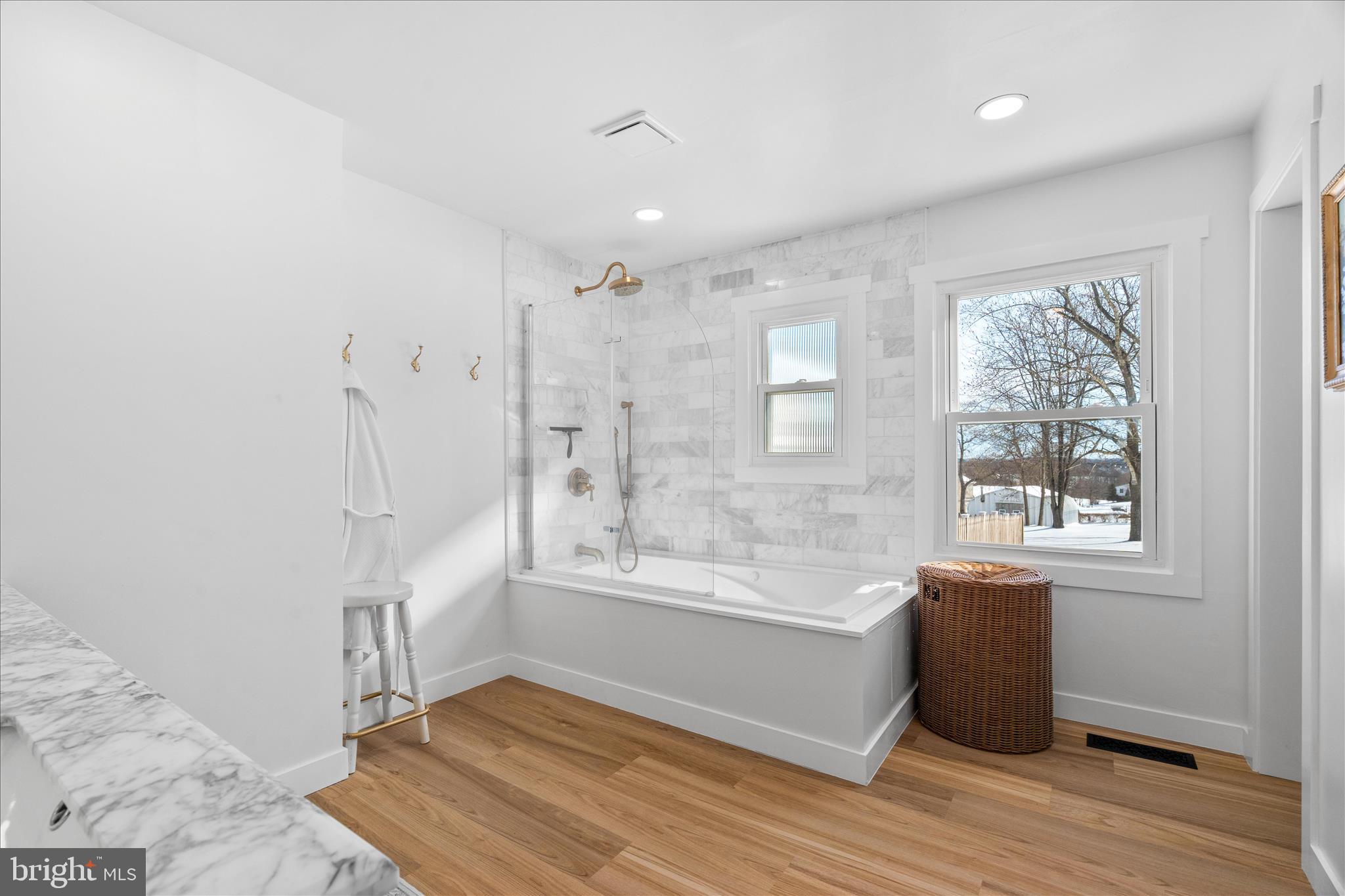7997 Pleasant Court Frederick, MD 21701 - Photo 31 of 78 a view of an empty room with a window and wooden floor