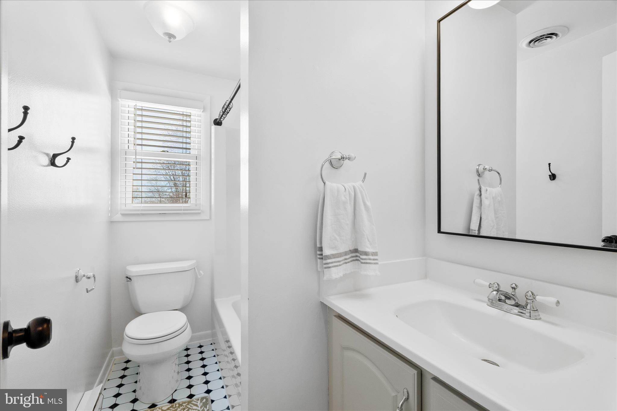 7997 Pleasant Court Frederick, MD 21701 - Photo 35 of 78 a bathroom with a sink toilet and shower