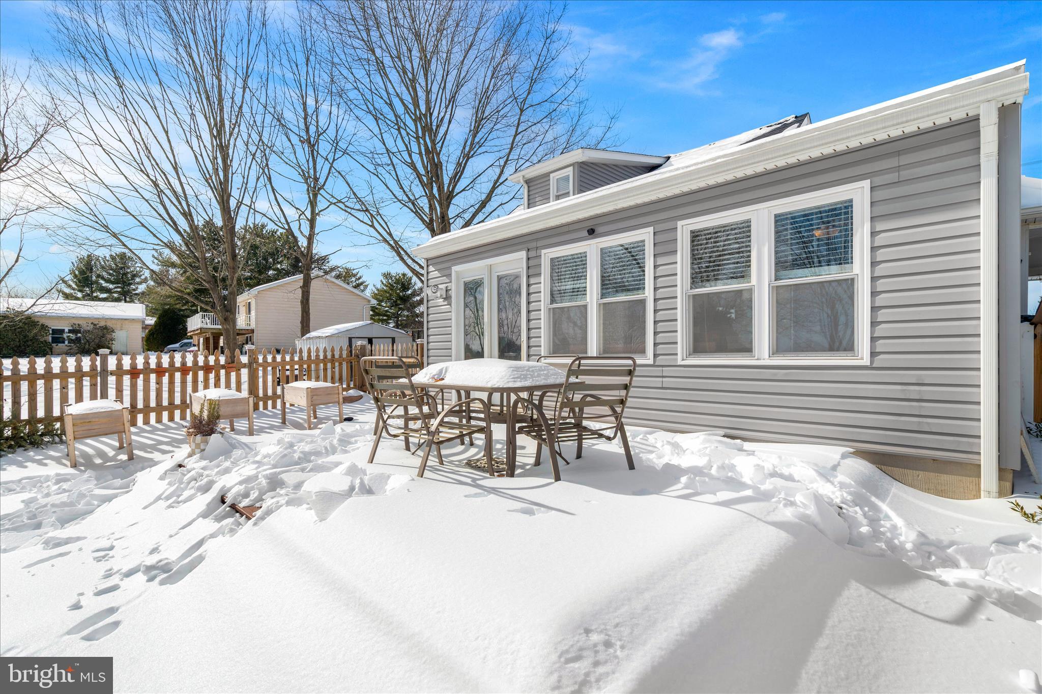 7997 Pleasant Court Frederick, MD 21701 - Photo 45 of 78 a view of a house with a bench in a patio