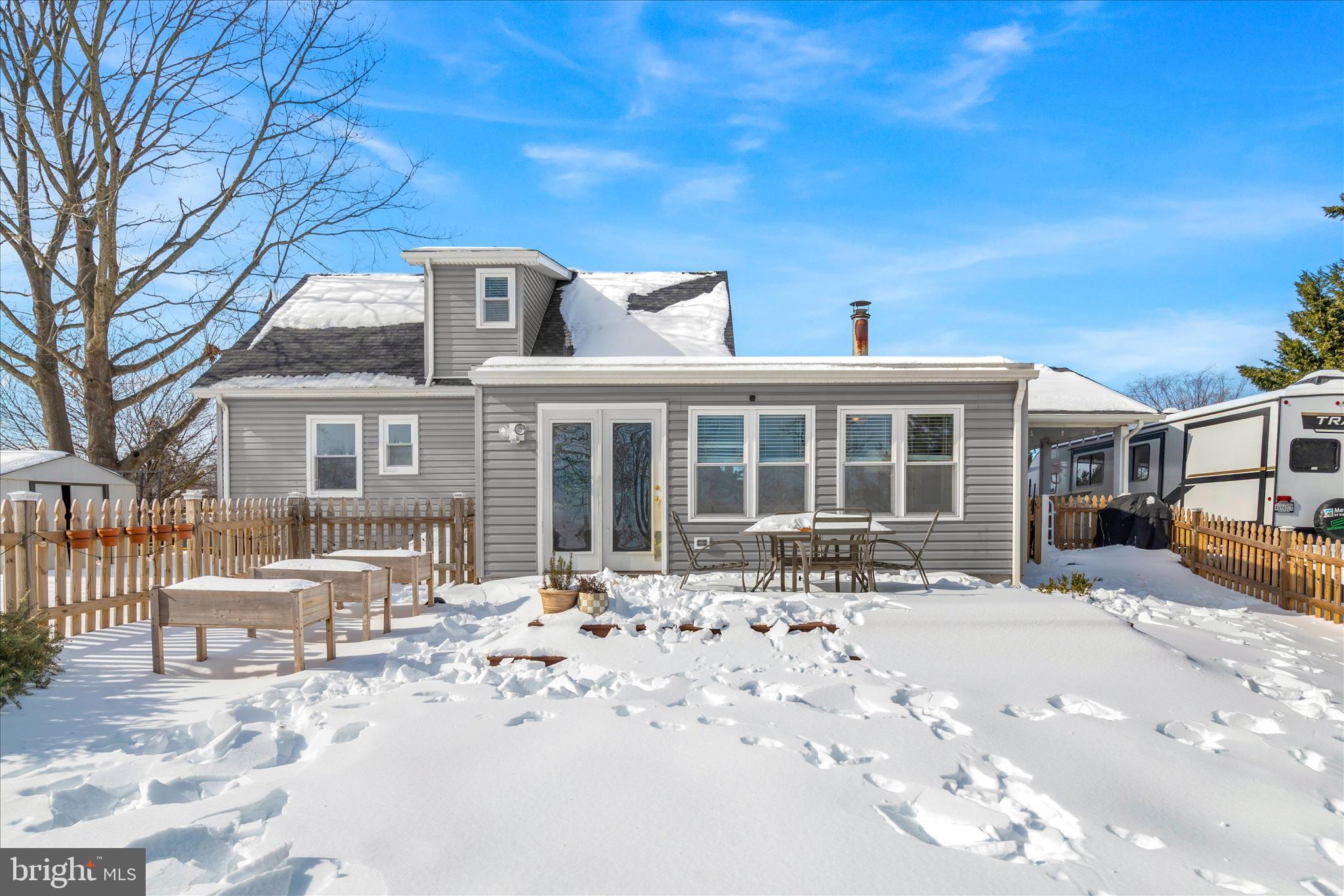 7997 Pleasant Court Frederick, MD 21701 - Photo 50 of 78 a front view of a house with a yard covered with snow and cars